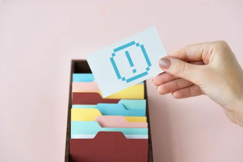 User holding alert card symbolizing data privacy and notifications on Threads by Meta